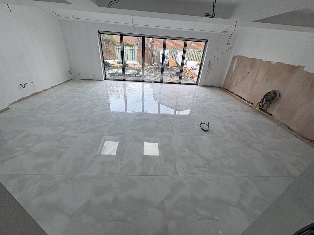 Finished — tiled floor and full-height glazing — extensions by Jenga Joiners in East Kilbride